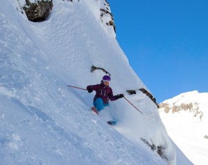 Woman skiing on steep slope